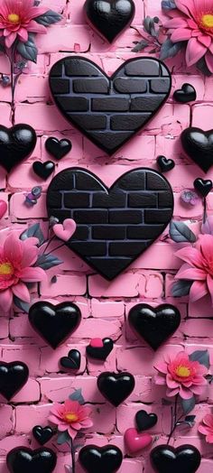 a brick wall with hearts and flowers on it