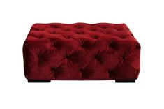 a red ottoman that is sitting on top of a table