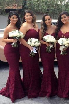 the bridesmaids are posing for pictures in their red gowns and bouquets