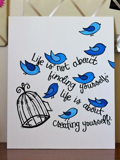 a card with blue birds and a birdcage that says life is not about finding yourself