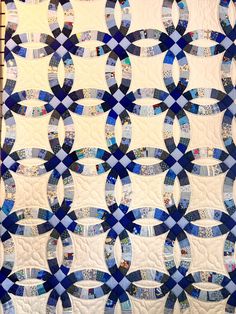 a blue and white quilt with circles on it