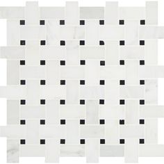 a white and black tile with squares on it