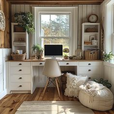 a home office with white furniture and wooden walls, along with lots of natural wood flooring