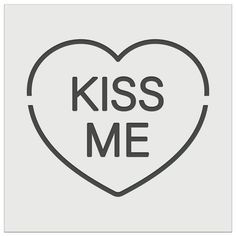 a heart with the words kiss me on it in black and white, against a gray background