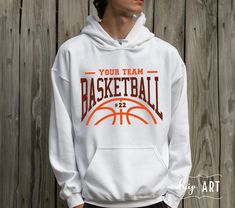 a young man wearing a white hoodie that says your team basketball