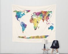 a white wall with a colorful world map on it