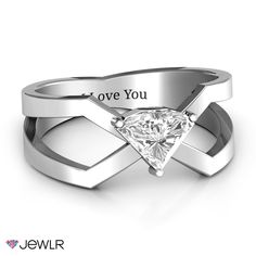 a heart shaped diamond ring with the words love you engraved on it's side