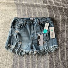 Studio Blue Distressed Jean Shorts (Size 2). Never Worn With Tags. Blue Cutoff Shorts For Summer, Blue Ripped Shorts For Summer, Blue Summer Bottoms With Frayed Hem, Blue Cotton Shorts With Frayed Hem, High Rise Blue Shorts With Frayed Hem, Blue Stretch Cutoff Jean Shorts, Stretch Ripped Blue Shorts, Blue Cutoff Summer Shorts, Summer Ripped Blue Shorts