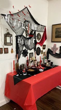 a table covered in red and black decorations