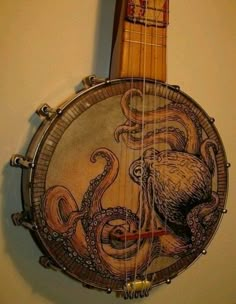 an octopus themed instrument hanging on the wall