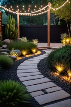 a garden with lights strung over the walkway