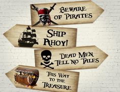 four wooden signs with pirate sayings on them