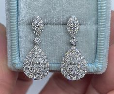 Stunning Pear Cut Diamond Dangling Earrings White Gold. Excellent craftsmanship, the diamonds are very clean and very sparkling. All VS grade diamonds, if you appreciate good quality diamonds. These sparkles from a mile away as they say. Heirloom quality earrings. The push backs have double notches for a secure fit. Measures 24 x 10mm. Genuine Pear Cut and Round Brilliant Cut Diamonds Total Weight: 1.62 Carats Clarity: VS Color: F/G All white and shiny diamonds, no cloudy or yellowish stones Sol Succession Wardrobe, Real Diamond Earrings Unique, Pear Diamond Earrings, Diamond Dangling Earrings, Real Diamond Earrings, White Diamond Earrings, Earrings White Gold, Moon And Star Ring, Fancy Jewellery Designs