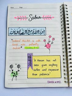 an open notebook with arabic writing on the page and flowers drawn in different colors around it