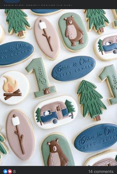 decorated cookies are arranged in the shape of trees and campers, including one for each child