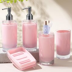 bathroom accessories including soap dispenser, soap dish and toothbrush holder on counter