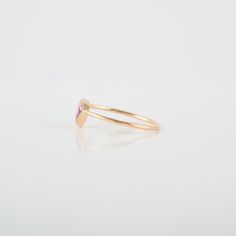 This ring with beautiful Natural sapphire, is set in 18K Solid Gold. It is a ring perfect for any gifting occasions for your loved ones. Purchase the perfect gift for your mom, wife, daughter, girlfriend, and fiancee. -Material - 18K Solid Yellow Gold -Gemstone - Genuine pink Sapphire -Gemstone weight - 2.840 ct -Gross weight - 1.20 grams Pink sapphires are recognized as having a variety of meanings, symbolizing good fortune, power through hardships, intense love and compassion, and subtle elega Gift Sapphire Open Ring, Gold Sapphire Stackable Rings For Gift, Minimalist Diamond Ring With Bezel Setting As Gift, Fine Jewelry Amethyst Halo Ring Gift, Minimalist Sapphire Ring With Bezel Setting As Gift, Minimalist Diamond Birthstone Ring As Gift, Dainty Pink Sapphire Promise Ring, Yellow Gold Emerald Cut Ruby Ring Gift, Gift Stackable Emerald And Diamond Ring