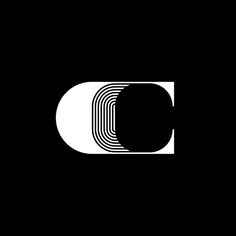 a black and white logo with the letter d in it's center, on a dark background