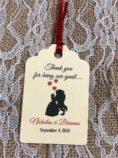 a wedding gift tag that says thank you for being our guest with a silhouette of a man and woman