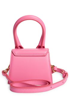 French designer Simon Porte Jacquemus made mini bags popular and this one proves why��—it may be small in size but it's big in impact. Magnetic-snap flap closure Top carry handle; removable, adjustable crossbody strap Structured silhouette with flat base for stability Cotton lining Leather Made in Italy Designer Handbags Small Designer Bag With Dust Bag Included, Small Elegant Shoulder Bag With Dust Bag, Small Luxury Evening Bag, Small Elegant Shoulder Bag, Small Luxury Evening Bags, Luxury Small Bag With Removable Pouch, Small Elegant Bag With Detachable Strap, Chic Small Bags With Removable Pouch, Chic Small Bag With Removable Pouch