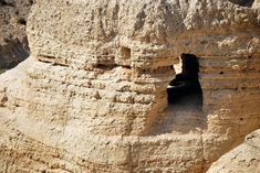 a rock formation with a small hole in the middle that has been carved into it