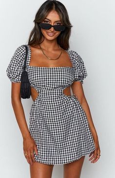 This flirty little number is perfect for those sunny days and warm nights. With its classic gingham print, it’s giving major picnic-in-the-park vibes, but the cut-out back adds just the right amount of sexy. Whether you’re heading to brunch with the girls or a cute date night, this dress is your go-to for effortless style. Pair it with your favorite sandals or sneakers, and you’re ready to slay the day! Fit and Features Open back that ties Mini length Puff sleeves Ties on the sides Runs true to Short A Line Dress, Line Dresses, Sundress Dress, A Line Dresses, Short Sleeve Mini Dress, Tie Dress, Fashion Colours, Mini Dress With Sleeves, Bodycon Mini Dress