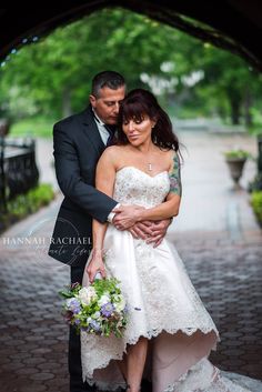 a bride and groom pose for a wedding photo