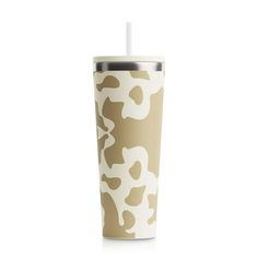 a cup with a straw in it on a white background and brown camouflage print pattern