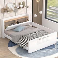 a white bed sitting on top of a wooden floor