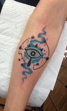 a person with a tattoo on their arm that has an all seeing eye in it