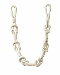 a white rope necklace on a white background