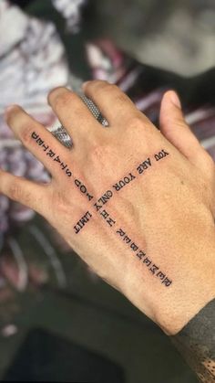 a person's hand with a tattoo on it that says, i love you