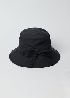 Our Water Resistant Rain Hat is a fashionable and fun take on our classic bucket hat that will keep you dry all season long. Shop Black Measurements: Brim Width- 2.45" Weight: 78g Professionally Dry Clean Rain Hat, Straw Fedora, Black Camel, Scarf Hat, Travel Collection, Medium Bags, Large Bags, Sun Hats, Arm Warmers