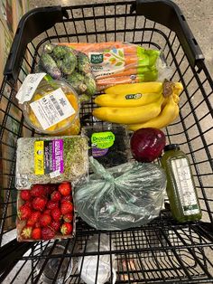 a shopping cart filled with fruits and vegetables