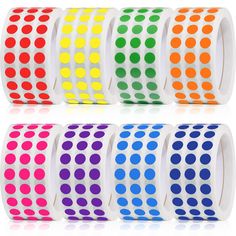 six different colored dots on white wristbands, each with an individual dot pattern