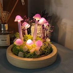 a group of mushrooms sitting on top of a wooden bowl