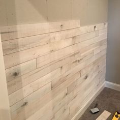 the wall is made out of wood and ready to be put in an area for painting