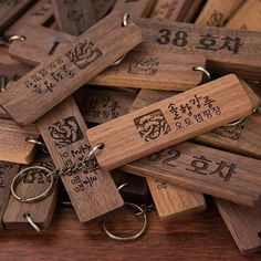 wooden key chains with engraved numbers on them