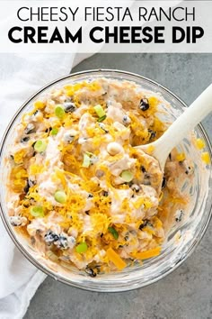 a glass bowl filled with cheesy fiesta ranch cream cheese dip