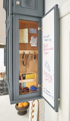 an open cabinet with writing on the door