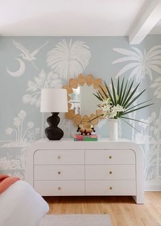 Our Charleston Marsh Mural, in collaboration with Megan Molten, captures the serene beauty of the South Carolina coast, featuring delicate motifs of palm trees, coastal flowers, and graceful birds. Rendered in a palette of muted colors—soft blues, gentle greens, and sandy beiges—it evokes the tranquil atmosphere of seaside living. The intricate patterns flow seamlessly, creating a sense of depth and movement. Ideal for adding a touch of elegance and coastal charm to any space, this wallpaper inv Charleston Marsh, Woodsy House, Beach House Decor Diy, Coastal Flowers, Megan Molten, Dining Room Bar Cart, Wallpaper Powder Room, Palm Springs Decor, South Carolina Coast