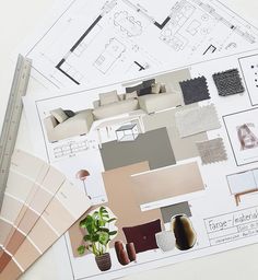 the floor plan is laid out on top of paper and paint swatches, along with other items