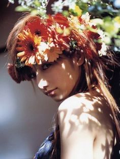 a woman with flowers in her hair