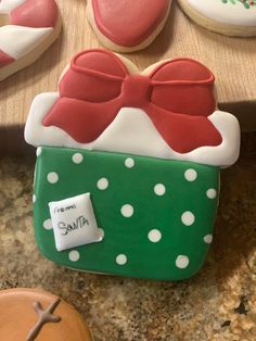 decorated cookies are sitting on a counter top