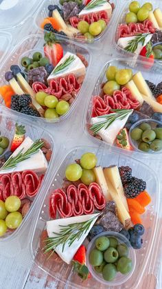 four plastic containers filled with different types of food