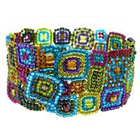 a multicolored beaded bracelet on a white background