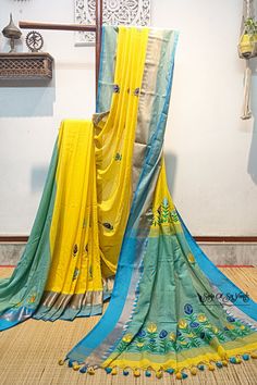 Elevate your ethnic wardrobe with our stunning handloom pure cotton saree in vibrant yellow, adorned with a magnificent firoza-colored temple woven border. This saree is a masterpiece of craftsmanship, featuring intricately embroidered multicolor floral design, neatly and artistically crafted onto the fabric. In addition to its exquisite design, this saree is designed for comfort and style. Crafted from pure, soft cotton, it offers a luxurious and comfortable drape, making it a joy to wear on any occasion. To complete the ensemble, a matching blouse piece with delicate embroidery work is included. Discover the perfect blend of tradition, artistry, and comfort with this exceptional pure cotton saree. Elevate your fashion quotient while celebrating the rich heritage of Indian textiles. Shop Yellow Cotton Handloom Traditional Wear, Yellow Cotton Traditional Wear With Resham Embroidery, Yellow Embroidered Saree For Festivals, Yellow Embroidered Saree For Diwali, Yellow Saree With Embroidered Border For Festivals, Yellow Cotton Saree With Zari Weaving, Yellow Cotton Dupatta With Zari Work, Yellow Embroidered Mulmul Traditional Wear, Yellow Mulmul Traditional Wear With Pallu