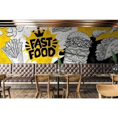 a restaurant with yellow and black graffiti on the wall