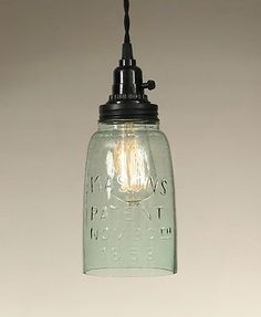 a mason jar light hanging from a ceiling