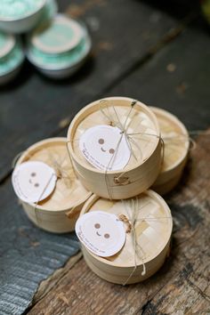 three spools of twine on top of each other with faces drawn on them